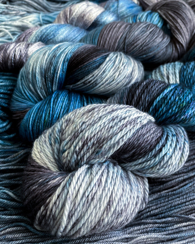 Close-up of blue and gray yarn skeins